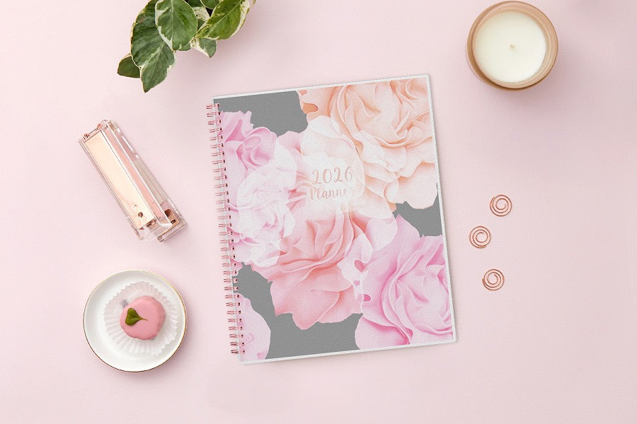 Take planning to the next level with this 2026 weekly monthly planner from Blue Sky featuring a cover with beautiful roses in shades of pink, rose gold twin wire-o binding in 8.5x11 planner size, and flexible front cover.
