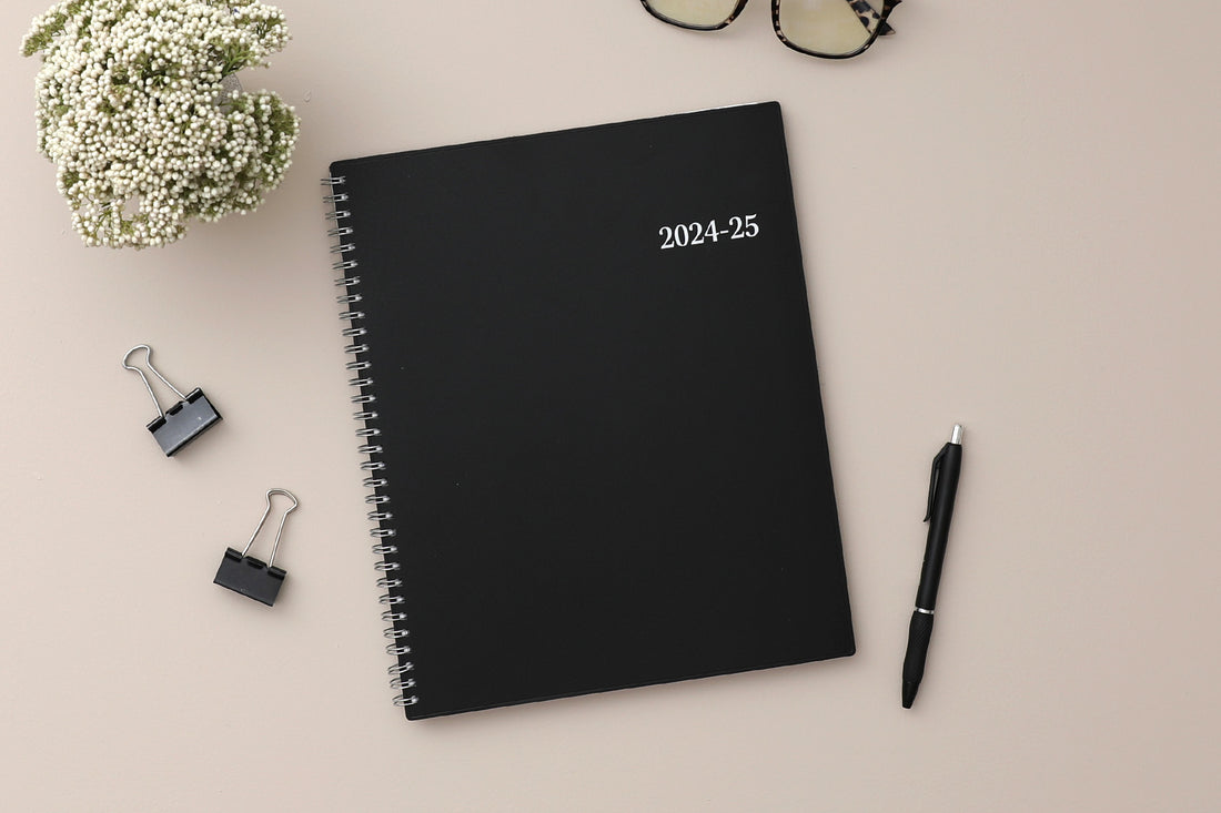 weekly monthly academic planner featuring a solid black cover and silver twin wire-o binding 8.5x11 size for july 2024 - june 2025
