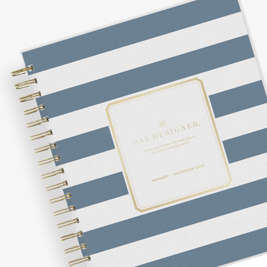 2026 daily monthly from day designer for blue sky featuring a hardcover, navy blue and white stripe design, gold twin wire-o binding in a compact 8x10 planner size.