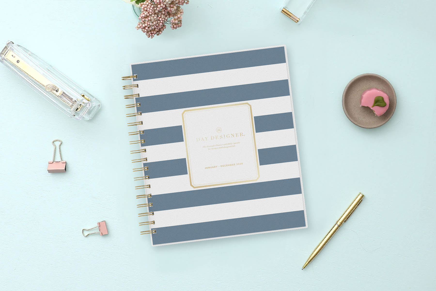2026 daily monthly from day designer for blue sky featuring a hardcover, navy blue and white stripe design, gold twin wire-o binding in a compact 8x10 planner size.