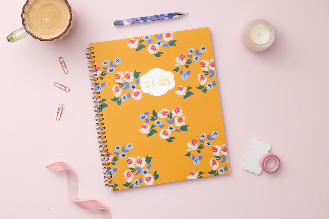 brushed floral pattern with gold yellow background in 8.5x11 planner size for July 2024-June 2025 titled &quot;The House That Lars Built&quot;.