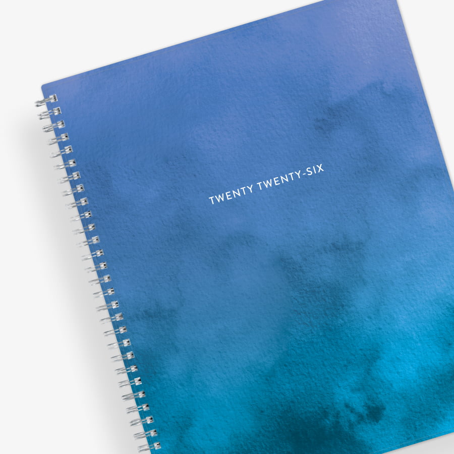 January 2026 to December 2026 weekly planner featuring a solid flexible oceanic ombre front cover, silver twin wire-o, and a 8.5x11 size planner