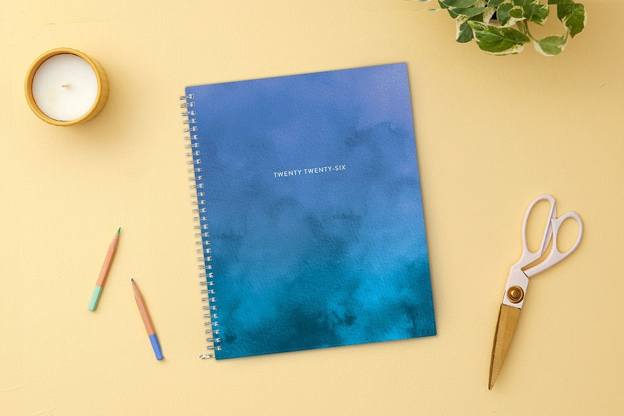 January 2026 to December 2026 weekly planner featuring a solid flexible oceanic ombre front cover, silver twin wire-o, and a 8.5x11 size planner