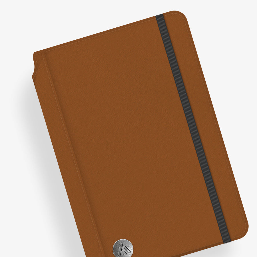 Brown notebook with a black elastic strap on a white background 5.75x8.5