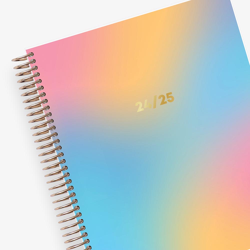 ombre rainbow 7x9 weekly monthly planner with gold wiire-binding on this July 2024-2025 academic planner