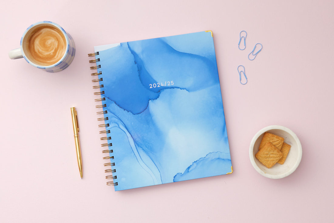 marble blue front cover in 8.5x11 planner size for this teacher lesson planner dated for July 2024- June 2025