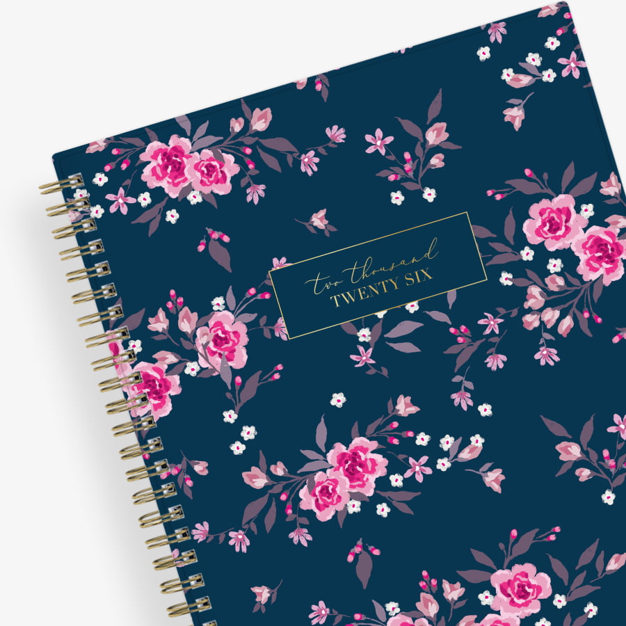 Floral 2026 planner with a blue background and pink flowers on a white background