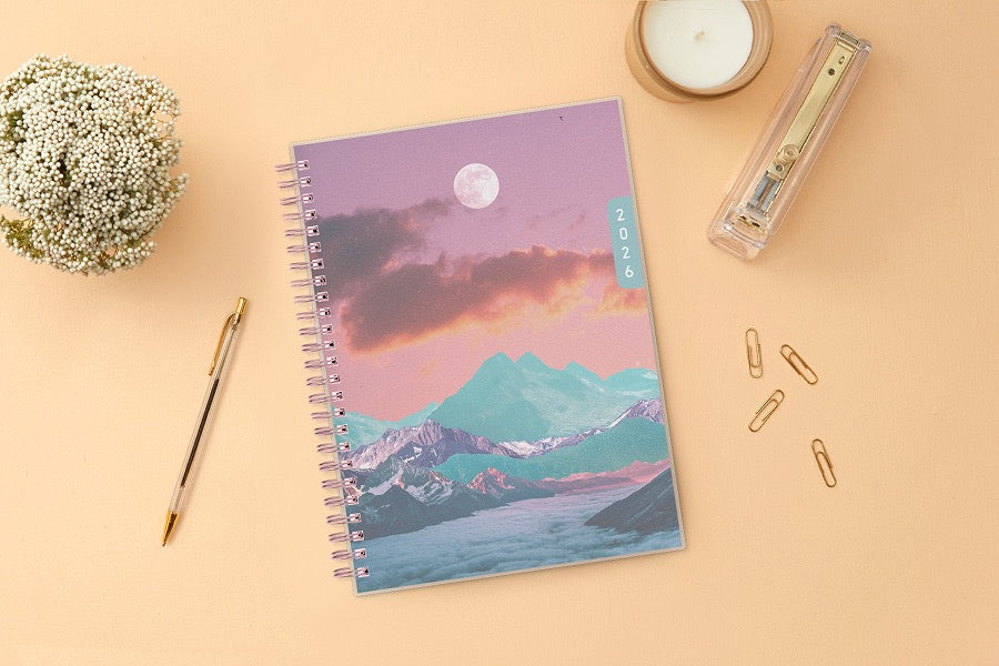 Spiral-bound planner with a mountain and moon design on the cover, featuring the year 2026 in 5.875x8.625