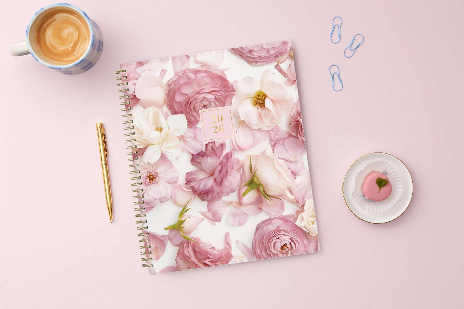 Floral patterned planner with a pink cover on a white background