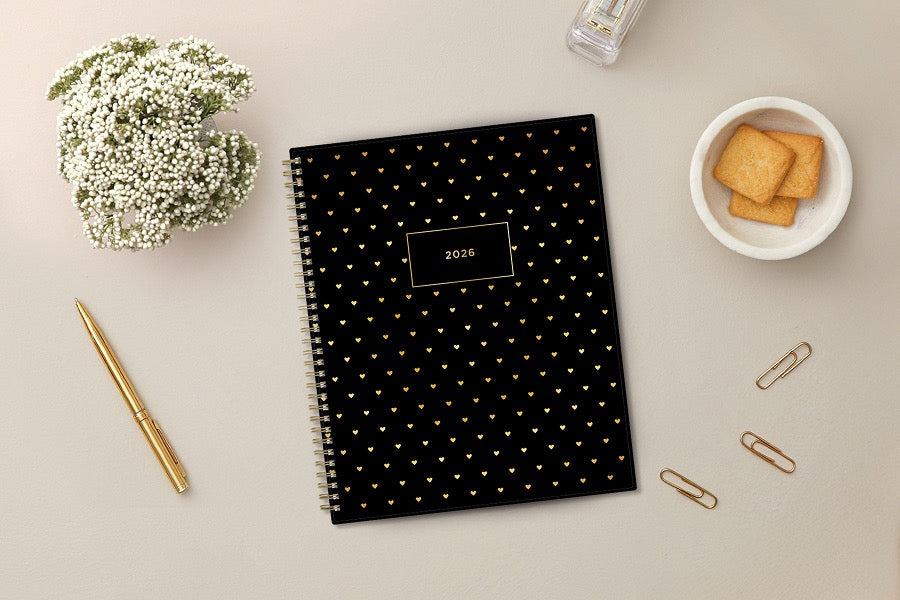 black background with gold hearts on both front and back covers of this 2026 planner