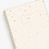 cream background with golden stars printed on this 8.5x11 planner