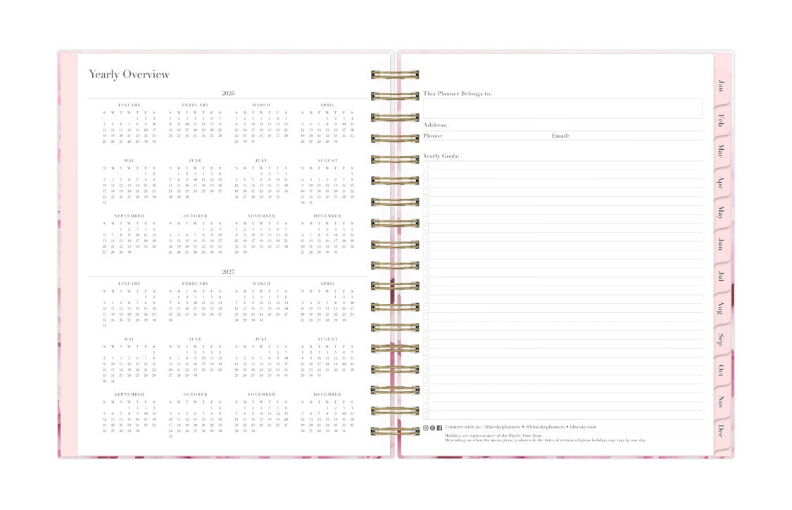 Spiral-bound planner with yearly overview on a white background 2026 and 2027