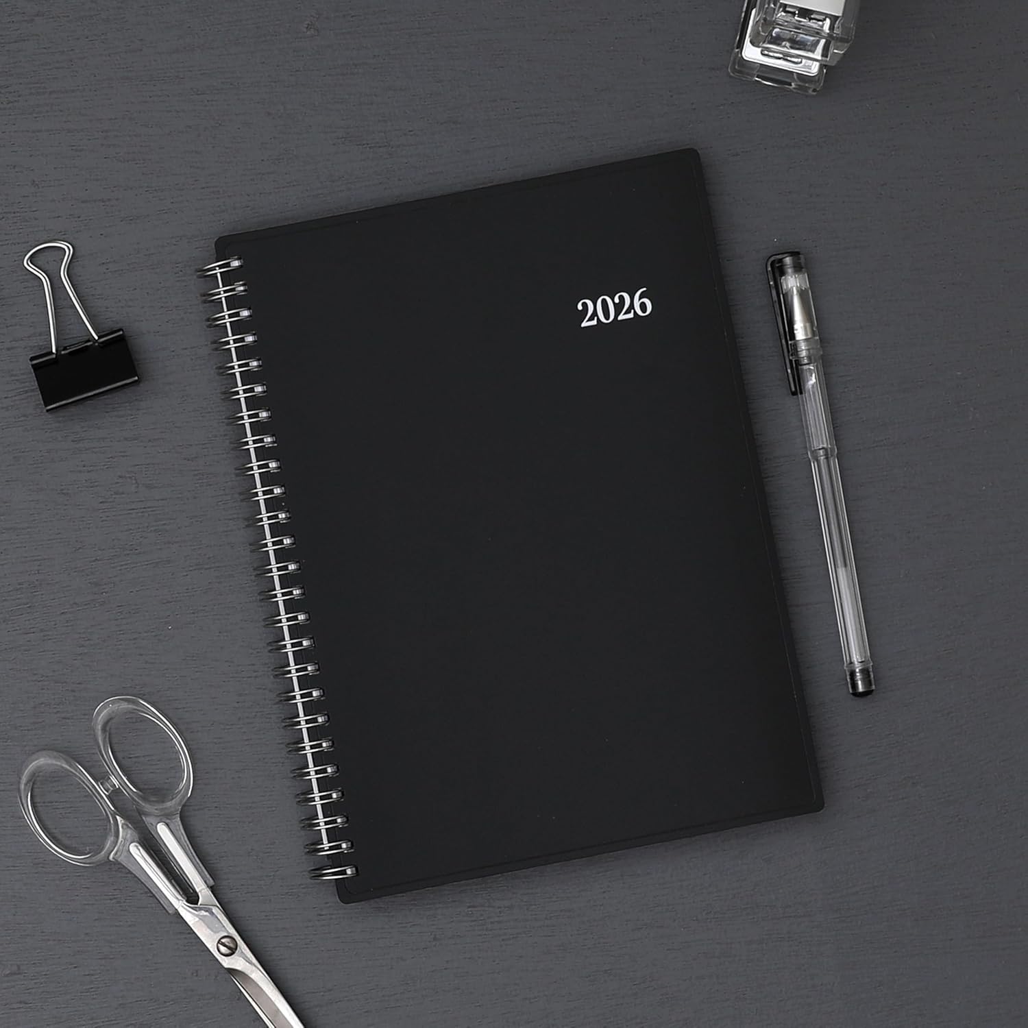 2026 planner featuring black cover in 5.875x8.625 planner notes format