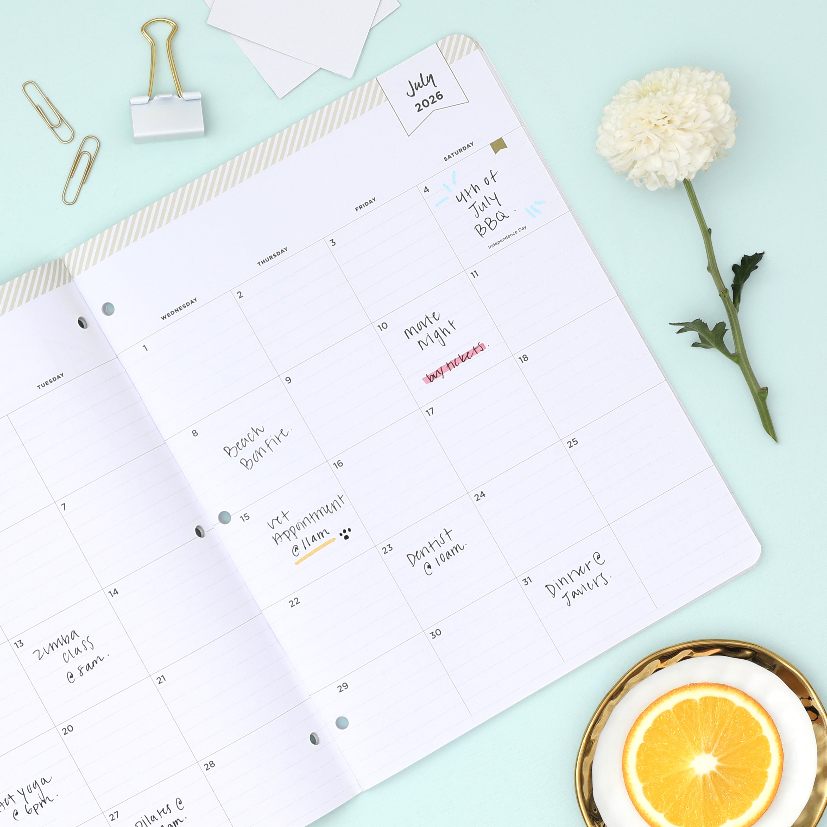 this july 2026 - june 2027 planner features a monthly spread with ample writing space for each day, monthly reference calendar, sections for note taking, bullet points, and check lists.