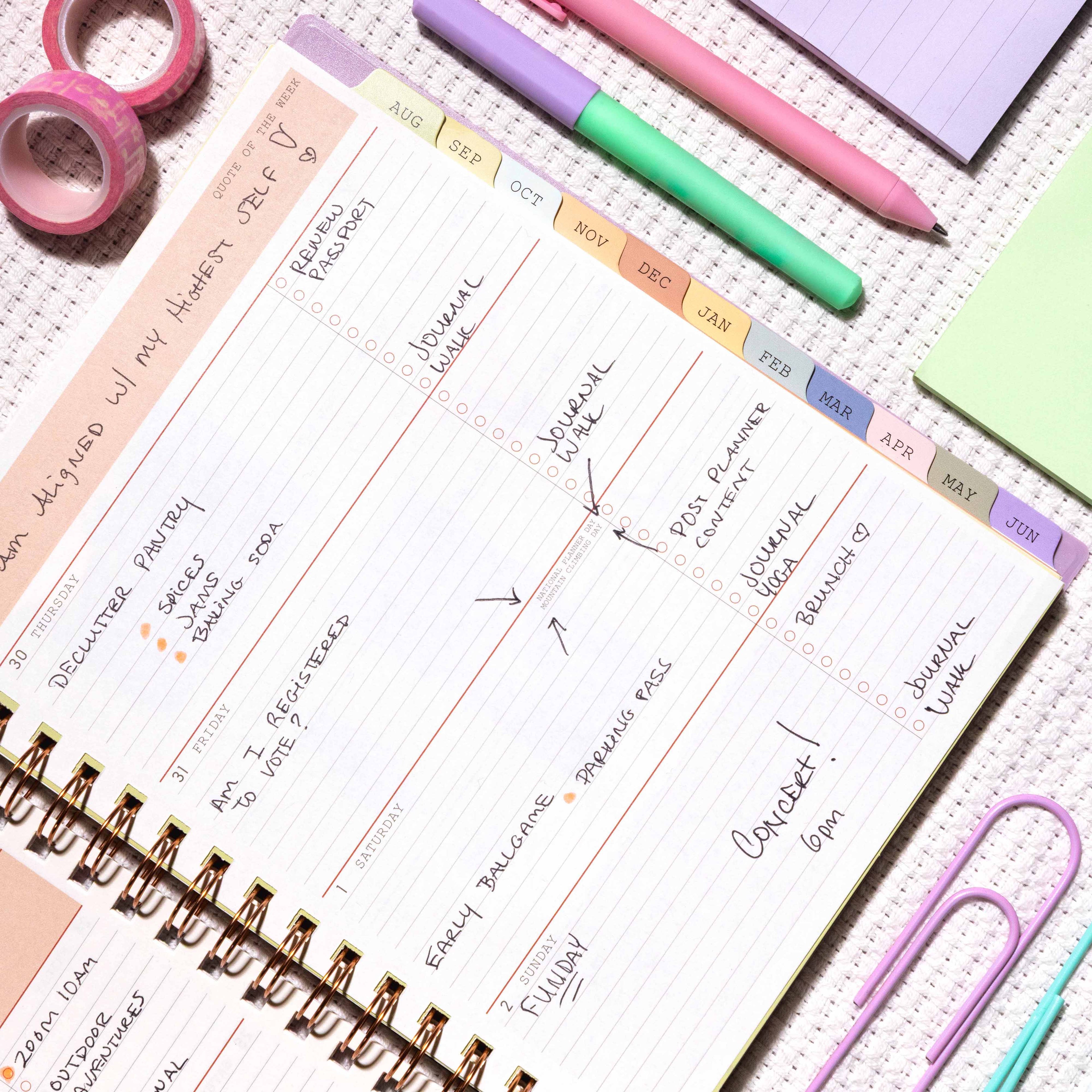 2026-2027 weekly spread featuring ample writing space, bullet points, to do-list and multi colored monthly tabs