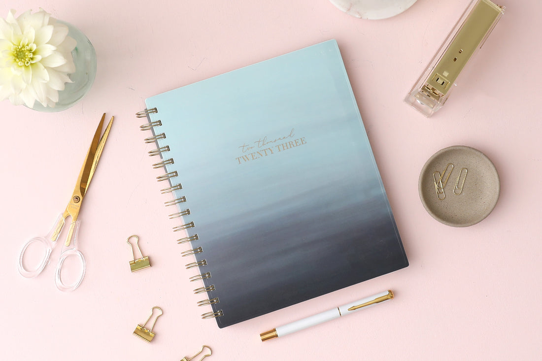 Life Note It for Blue Sky features this 7x9 weekly monthly planner notes featuring a wavy oceanic teal front cover and gold twin wire-o binding.