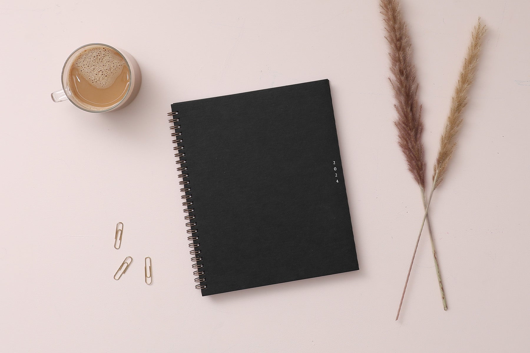 2024 weekly monthly planner featuring gold wire binding 8.5x11 planner size and deep dark green cover