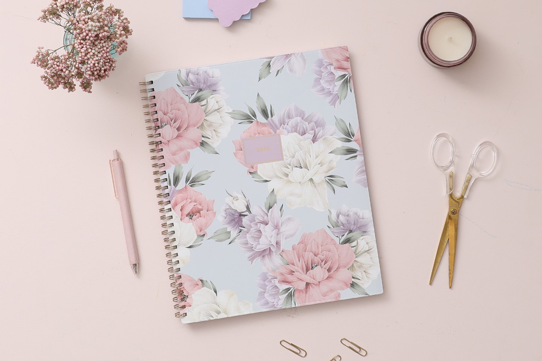 2024 weekly monthly planner featuring floral pattern and gold twin wire-o binding in 8.5x11 planner size