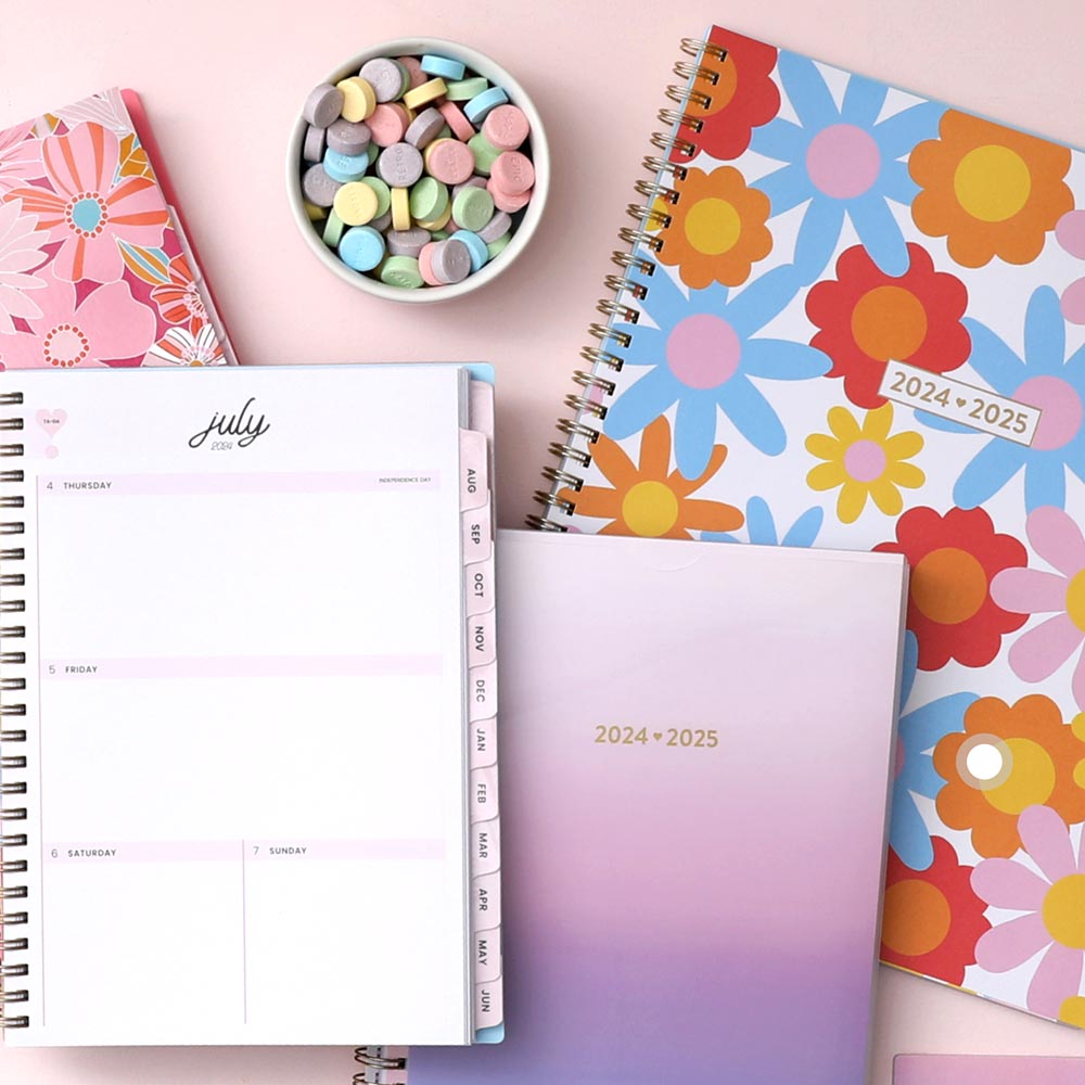 Stay organized with Color Me Courtney's vibrant planners, and candy on a pink surface - ideal for planning your day with hourly layouts!