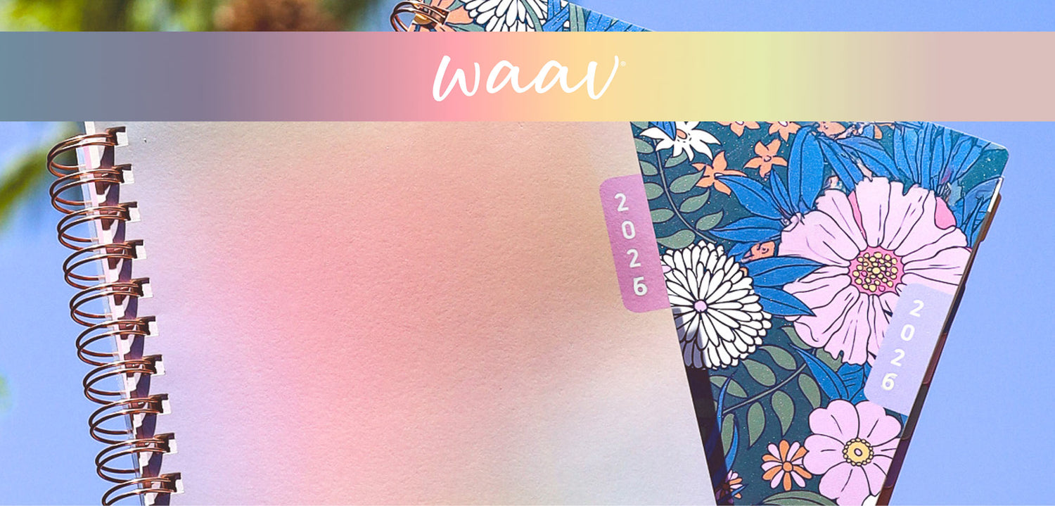 Floral planner and pastel gradient planner with 'waav' branding on a colorful against a blue sky
