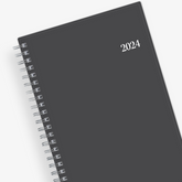 January 2024 - December 2024 weekly monthly planner featuring a charcoal front cover design and silver twin wire-o binding