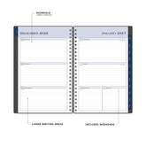 weekly spread featuring lined writing space, and blue monthly tabs