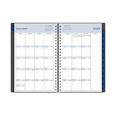 monthly layout featuring lined writing space, notes section, and blue monthly tabs