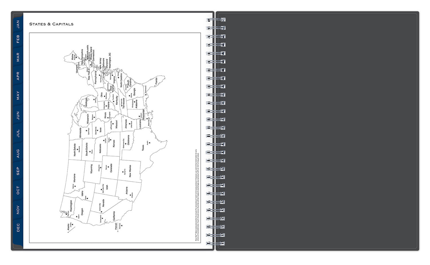 Spiral-bound planner with a map of the United States on one page and a dark gray cover on the other.