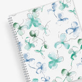 January 2024 to December 2024 weekly and monthly planner from Blue Sky featuring a floral pattern in hues of blue with twin silver wire-o binding and compact 8.5x11 size