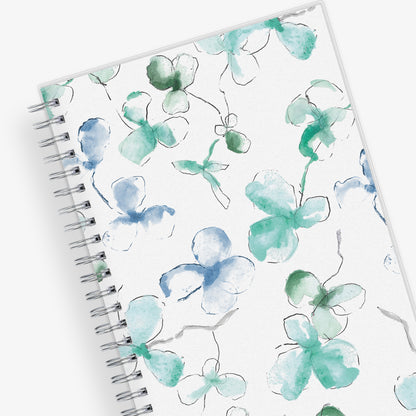 January 2024 to December 2024 weekly and monthly planner from Blue Sky featuring a floral pattern in hues of blue with twin silver wire-o binding and compact 5x8 size