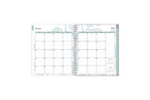 2024 monthly planner featuring a monthly spread with boxed dates, lined writing space, reference calendar, notes section, and light blue monthly tabs