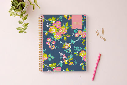 January 2024 - December 2024 weekly monthly planner in 8.5x11 size from day designer for blue sky with navy background and floral design, and gold twin wire-o binding