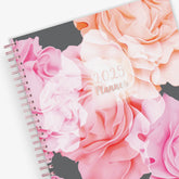 Take planning to the next level with this 2025 weekly monthly planner from Blue Sky featuring a cover with beautiful roses in shades of pink, rose gold twin wire-o binding in 8.5x11 planner size, and flexible front cover.