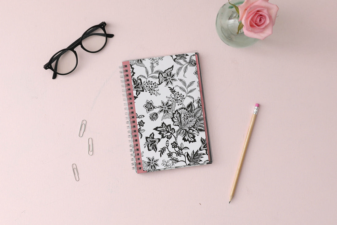 2024 weekly and monthly planner from Blue Sky featuring a floral pattern in black and white with twin silver wire-o binding and compact 5x8 size