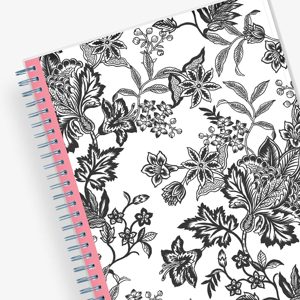 Monthly planner in 8x10 planner size with white background and black printed florals