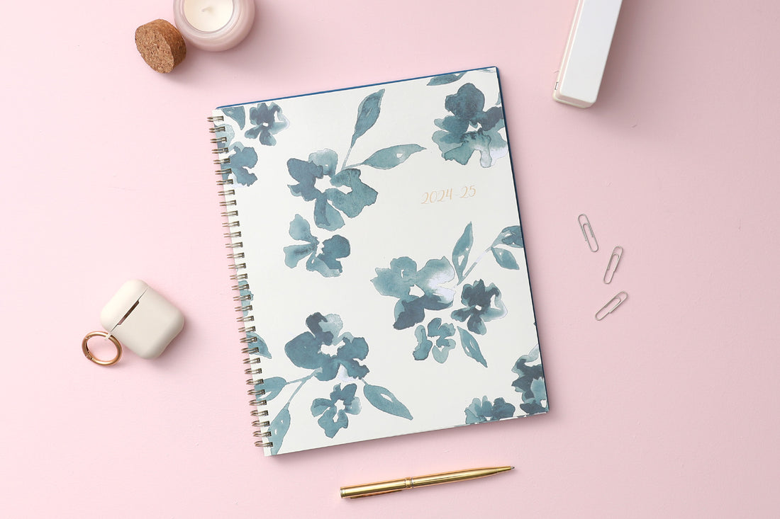 academic weekly monthly planner featuring a white background and blue paint brush florals, twin wire-o binding in a 8.5x11 planner size for the school year 2024-2025 year