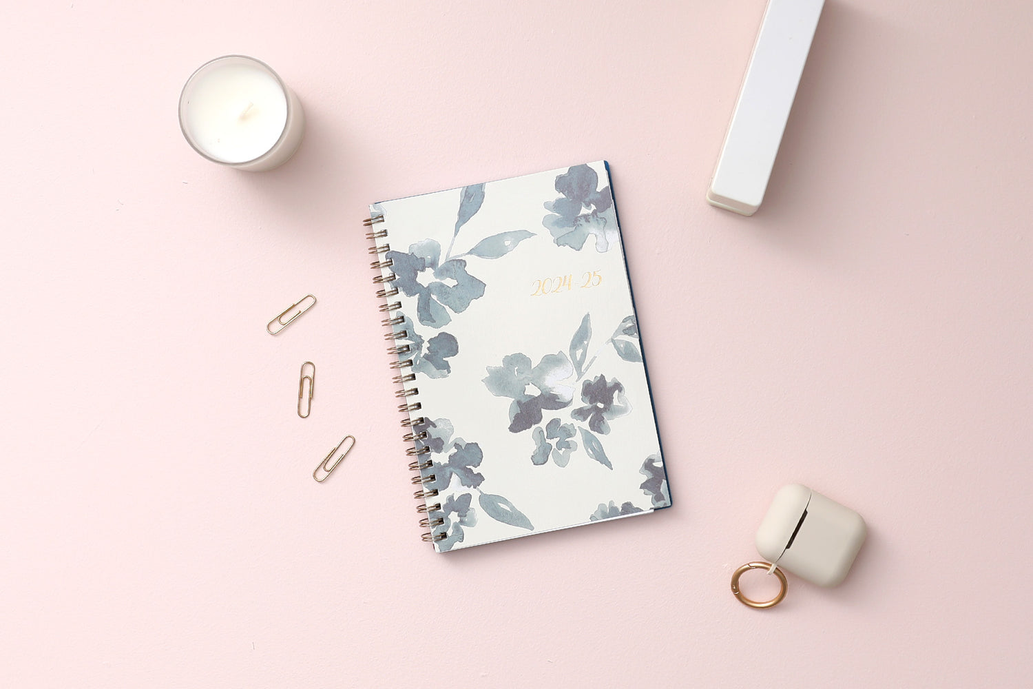 academic weekly monthly planner featuring a white background and blue paint brush florals, twin wire-o binding in a 5x8 planner size for the school year july 2024- june 2025