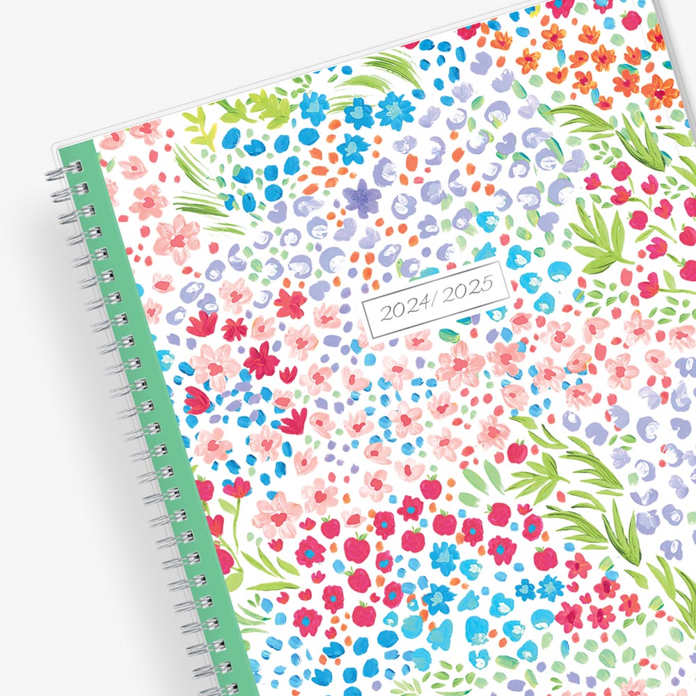 academic teacher lesson planner with weekly and monthly layouts featuring a multi colored floral front cover in 8.5x11 planner size