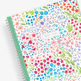 academic teacher lesson planner with weekly and monthly layouts featuring a multi colored floral front cover in 8.5x11 planner size 2024-2025