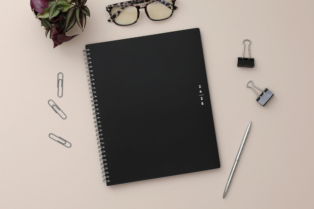 academic teacher lesson planner with weekly and monthly layouts featuring a solid black front cover in 8.5x11 planner size July 2024 - July 2025 year