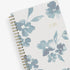 blue sky weekly monthly 2026 planner featuring blue water brushed florals and beige background cover