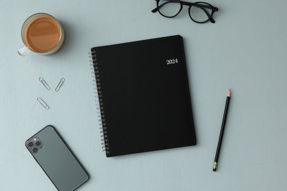January 2024 - December 2024 weekly monthly planner featuring a black front cover design and silver twin wire-o binding