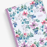 Blue Sky January 2024 - December 2024 weekly monthly planner featuring a floral front cover design with silver wire-o binding