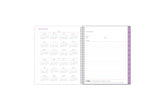 2024 and 2025 yearly overview on the 8.5x11 weekly monthly planner featuring blue monthly tabs, yearly goals, notes, and contact information.