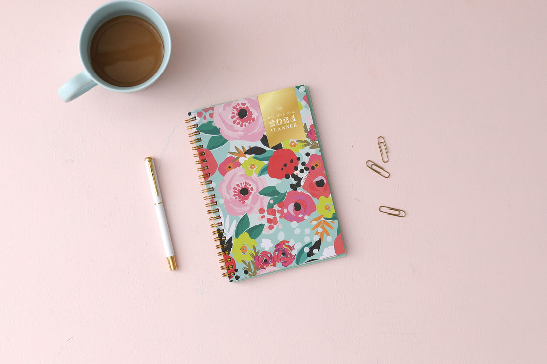 This 2024 monthly planner features a cute and fun floral pattern with gold twin wire-o binding