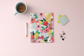 This 2024 monthly planner features a cute and fun floral pattern with gold twin wire-o binding