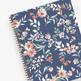 in partnership with one tree planted, the 2024 weekly monthly planner features a cute floral pattern and navy background cover.