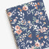 in partnership with one tree planted, the 2024 weekly monthly planner features a cute floral pattern and navy background cover.