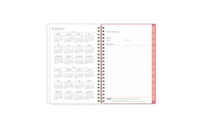 5x8 2024 weekly monthly planner features a yearly overview of 2024 and 2025 with contact page for owner of planner and bulleted yearly goals and accomplishments with pink monthly tabs and white text