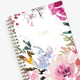 The kelly ventura 2024 weekly monthly planner for blue sky features beautiful watercolored floral cover with gold twin wire-o binding in a 5x8 planner size.
